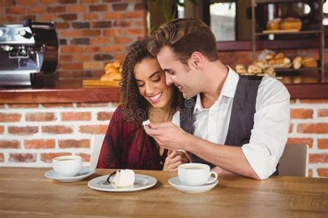 Young Happy Couple Feeding Each Other With Cake Stock Photo Image Of