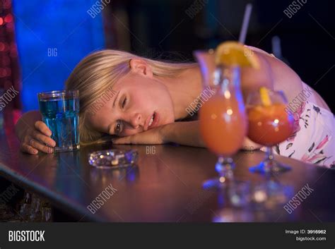 Drunk Young Woman Passed Out Bar Image And Photo Bigstock