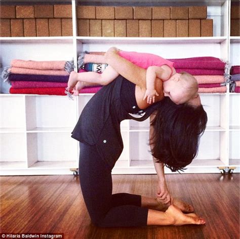 Hilaria Baldwin Shows Off Lean Figure In Yoga Pose Feeding Daughter