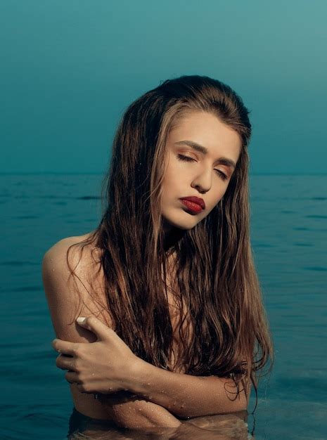 Premium Photo Sexy Brown Haired Woman With Red Lipstick Posing Standing In The Sea