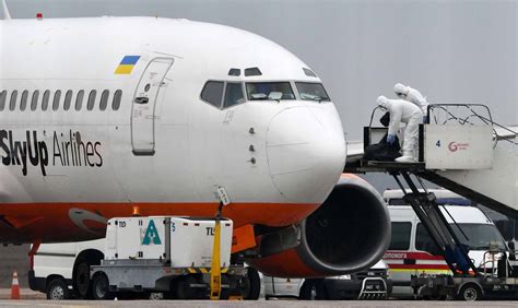 Plane carrying evacuees from Wuhan arrives in Ukraine and prompts local