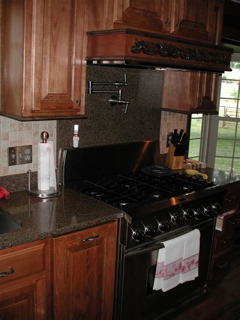 The backing is first attached to the tops of the wall cabinet to act as an anchor point for the molding to attach to. Maple Stained Cabinets With a Darker Crown Molding - Traditional - Kitchen - Other - by ...