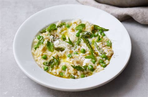Salmon risotto is always a winner, and this one uses fish and sweet peas from the freezer! Salmon Risotto Recipes Jamie Oliver