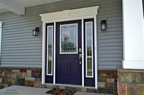 Vector image dark purple spooky house with wooden porch. de Jong Dream House: Our purple door
