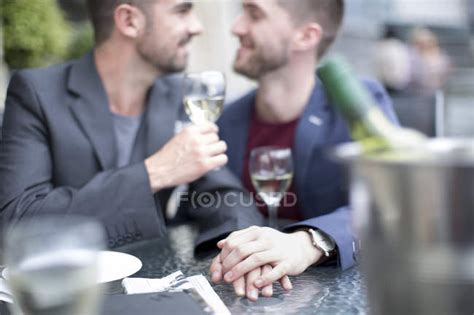 Gay Couple Sharing An Intimate Moment At A Restaurant — Table 20 25