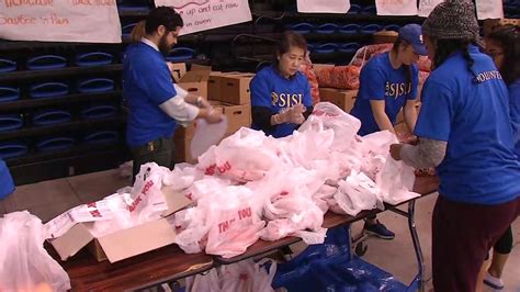 Volunteers from local/sponsoring organizations unload the trailer and repackage the food. Second Harvest Food Bank brings mobile pantry to SJSU ...