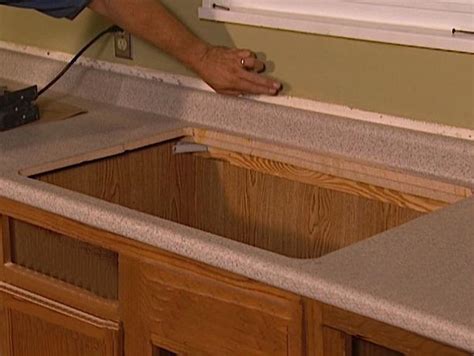 Position the new countertop over the top of the cabinet, and place the level on top of the countertop to see if it is level. How to Install and Maintain your own Kitchen Countertops ...