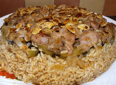 Maqluba or upside down recipe,a traditional arabic recipe cooked with rice,chicken or meat and fried vegetables like eggplant. 12 Things to do in Jordan | Petra Nights Tours