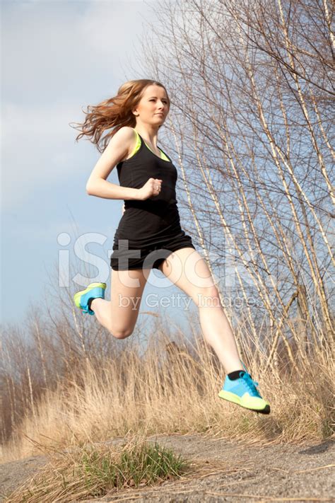 Young Woman In Sport Dress Running Stock Photo Royalty Free Freeimages