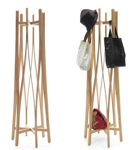 These hangers are crafted from wood sourced from the lotus tree in china. Flat-Pack Coat hanger by Aesthetic Studio - InteriorZine