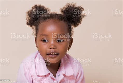 Studio Portrait Of A Cute Young African American Girl Stock Photo