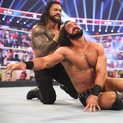 photos mcintyre and reigns brutalize one another in jaw dropping slugfest wwe superstar roman
