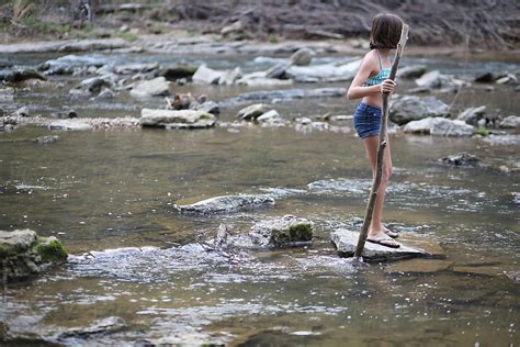 Girl Walking Across A River By Stocksy Contributor Alicia Bock
