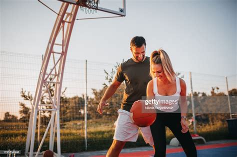 Happy Couple Playing Basketball High Res Stock Photo Getty Images