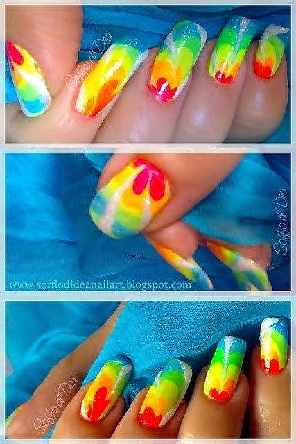 Four Different Pictures Of Colorful Nail Designs