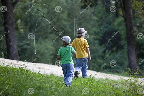 Happy Teen Boys Go Fishing On The River Children Of The Fisherman With
