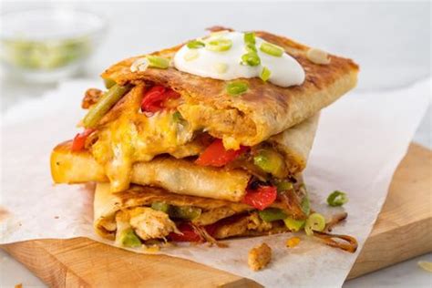 Sprinkle with cheese, onion, tomato and chicken. Easy Chicken Quesadilla Recipe - How to Make Best Chicken ...