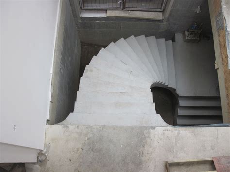 Digitally modeled and fabricated concrete spiral staircase.the thickness of the spiral staircase is invisible at its inner and outer end.the beauty of the st. Helical concrete stairs in Kent | Concrete stairs ...