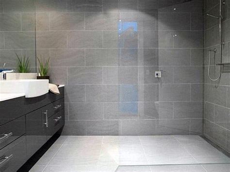 Tiles provide the perfect opportunity to get creative monochrome is a popular colour combination for bathrooms, largely because it's so versatile and assign mid grey tiles to your floor, plain cream to three walls and a mix of pebble tones to the fourth. Top 60 Best Grey Bathroom Tile Ideas - Neutral Interior ...