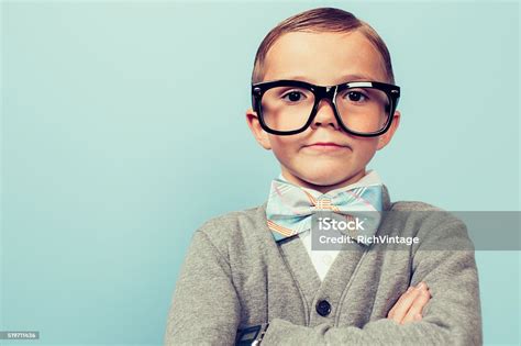 Young Nerd Boy Folding Arms And Blank Expression Stock Photo Download