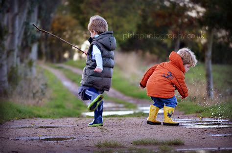 Children playing in muddy puddles | Kids playing, Photography portfolio, Winter jackets
