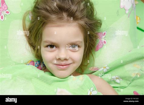 Girl Lying In Bed Stock Photo Alamy