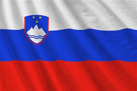 Premium Photo Slovenia Flag With Big Folds Waving Close Up Under The