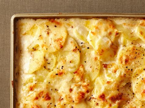 My husband's scalloped potatoes are one of his signature dishes, but when he decided to shake things up a bit with a new recipe he discovered by ina garten, he may have redefined the way we'll approach this comfort food classic in the future. 7 Spins on Scalloped Potatoes to Try This Easter | Food network recipes, Scalloped potato ...