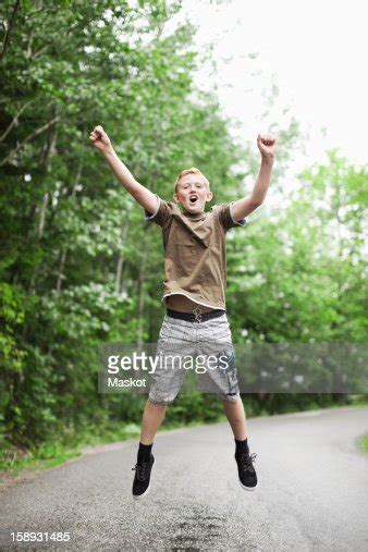 Excited Boy Jumping In Midair High Res Stock Photo Getty Images