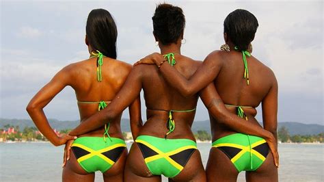 Three Jamaican Girls Wearing Bikinis With The Jamaica Flag Design