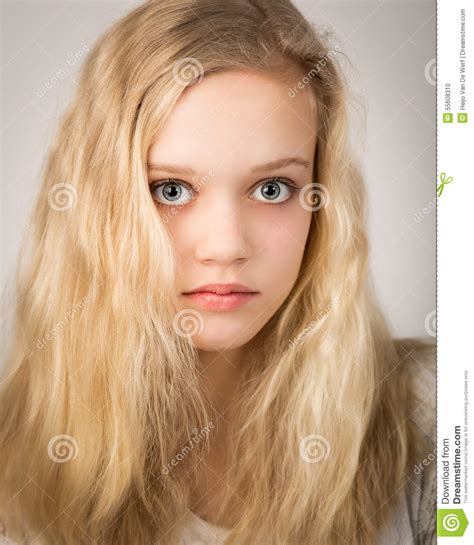 Beautiful Blond Teenage Girl Looking In The Camera Royalty