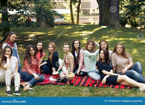 Stylish Happy Group Of Women Posing And Smiling On Picnic Sitting On