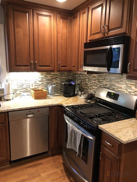 There are some faux marbles that are gorgeous. Timeless White kitchen - 2 Cabinet Girls