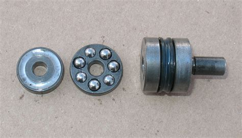 Rotate the engine so that the a push rod tappet moves down completely in its bore. BMW motorcycle throwout bearings and clutch pushrods