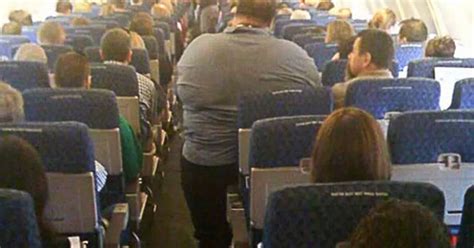 Fat Flyers To Be Charged For Two Seats See Amazing Picture Of One Obese Man On Plane Mirror