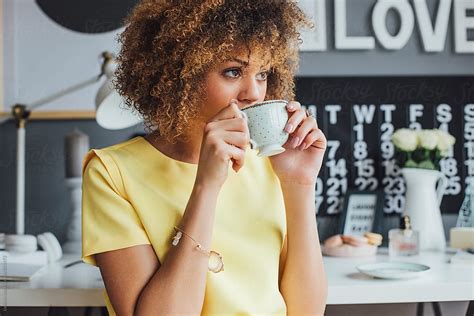 African Woman Drinking Coffee At Home By Stocksy Contributor Lumina Stocksy