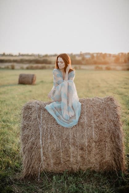 premium photo sexy girl in underwear posing on a haystack in summer at sunset in nature added