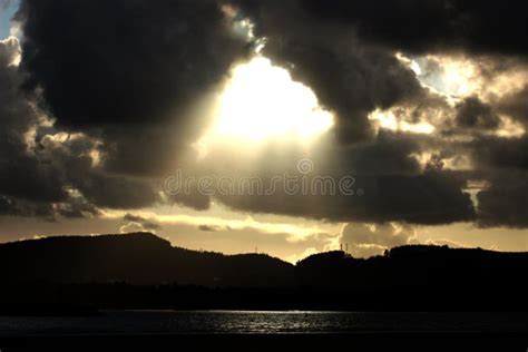 Bright Rays Of The Sun Shine Trough Dark Clouds Stock Image Image Of