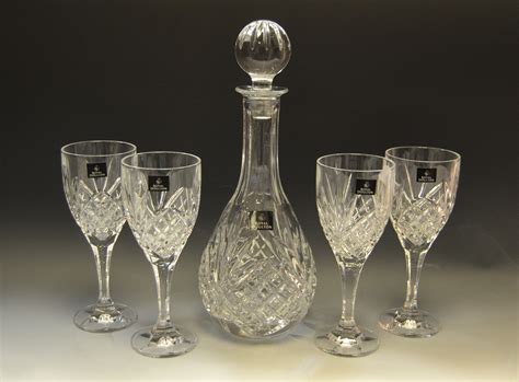 A Royal Doulton Crystal Glass Wine Decanter And Four Conforming Glasses