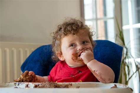 Baby Is Eating A Chocolate Cake Stock Photo Image Of Face Food