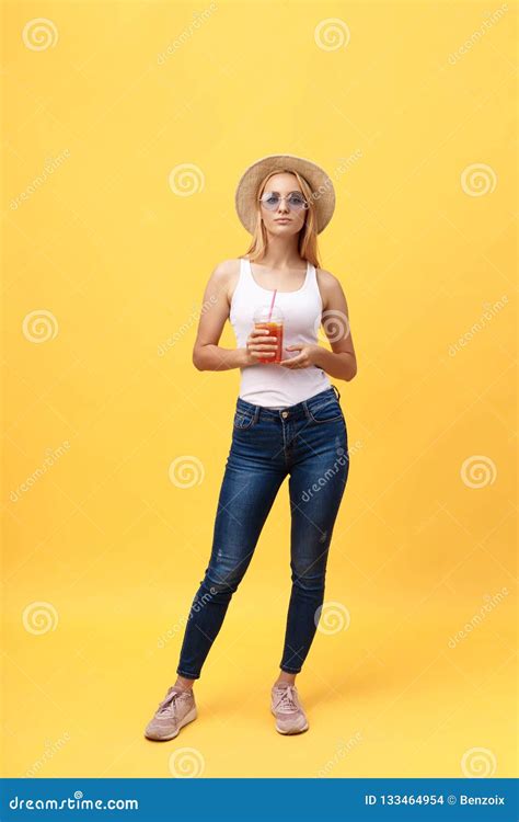 Full Length Portrait Of A Cheerful Young Woman Wearing Summer Clothes