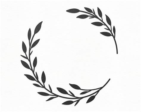 A Black And White Drawing Of A Circle With Leaves On Its Sides In The
