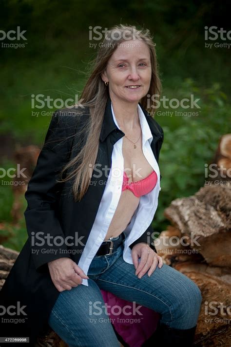 Cute Mature Woman Posing In Forest On A Spring Afternoon