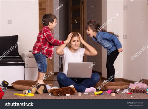Busy Mother Romping Kids Multitasking Woman Stock Photo 1572426175