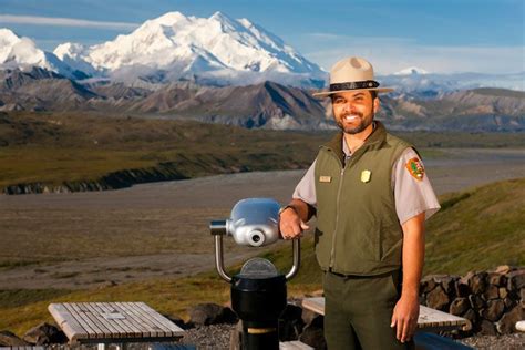 Ranger At Eielson Visitor Center In Alaska With View Of Mt Mckinley