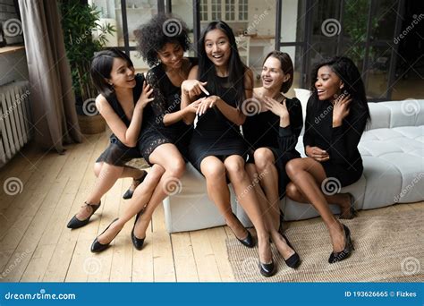 asian bride showing to bridesmaids ring during bachelorette party celebration stock image