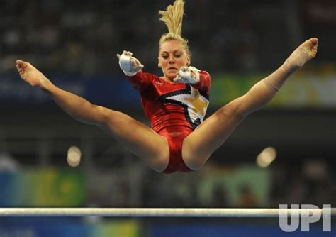 American Gymnast Peszek Peforms The Uneven Bars In Womens Gymnastics