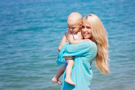 Mother With Her Baby On The Beach Stock Image Image Of Parenting