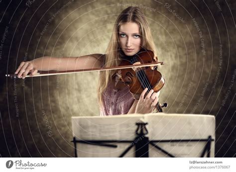 Pretty Young Violinist Playing The Violin A Royalty Free Stock Photo