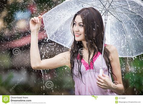 Beautiful Girl In The Rain With Transparent Umbrella Stock